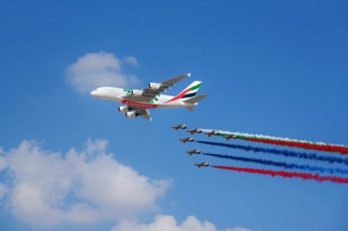 The Emirates A380 marks the opening of the Dubai Airshow with unprecedented flypast accompanied by 26 Military and Air Display Aircraft